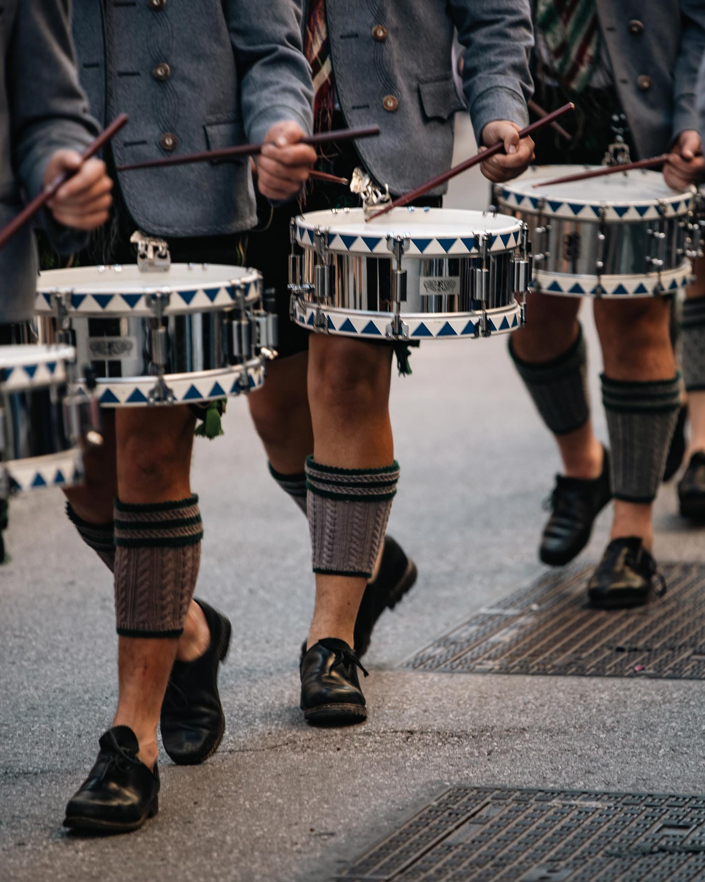 Traditional drummers in lederhosen during a parade